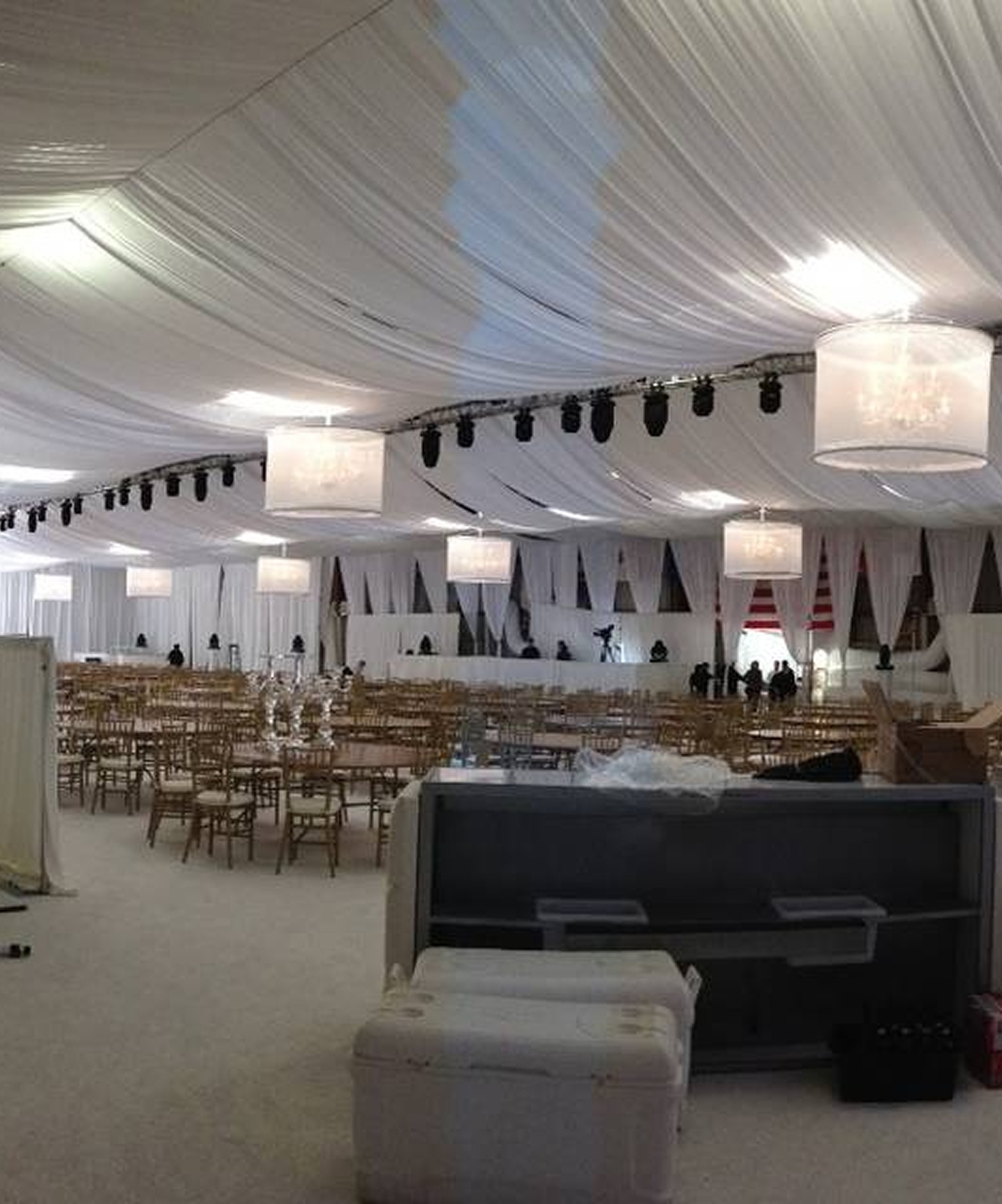 Large wedding reception setup at Sun ‘n Fun with white draped ceiling, chandeliers, and spacious banquet layout