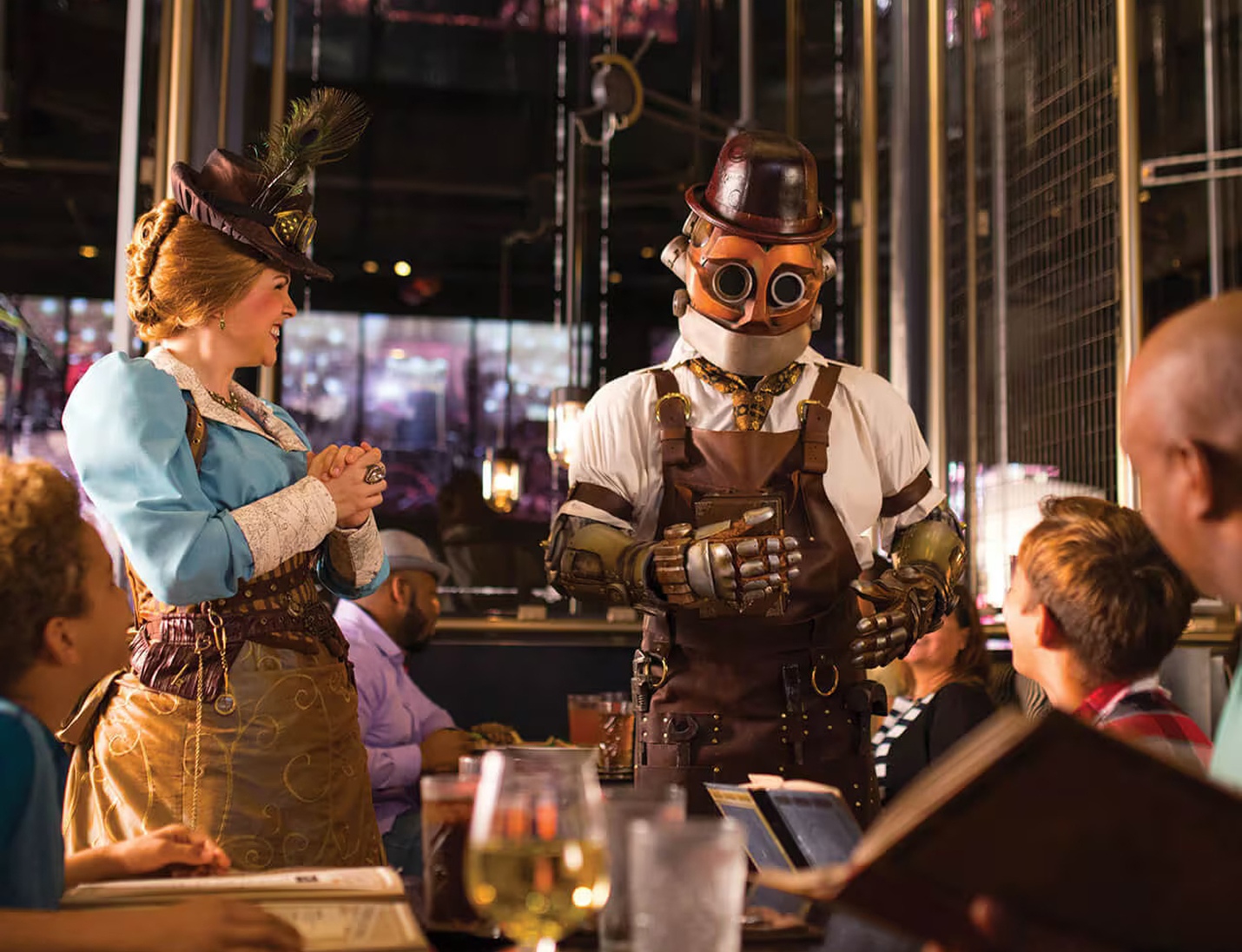 Themed scene at Chocolate Factory with costumed staff interacting with guests in a lively dining atmosphere