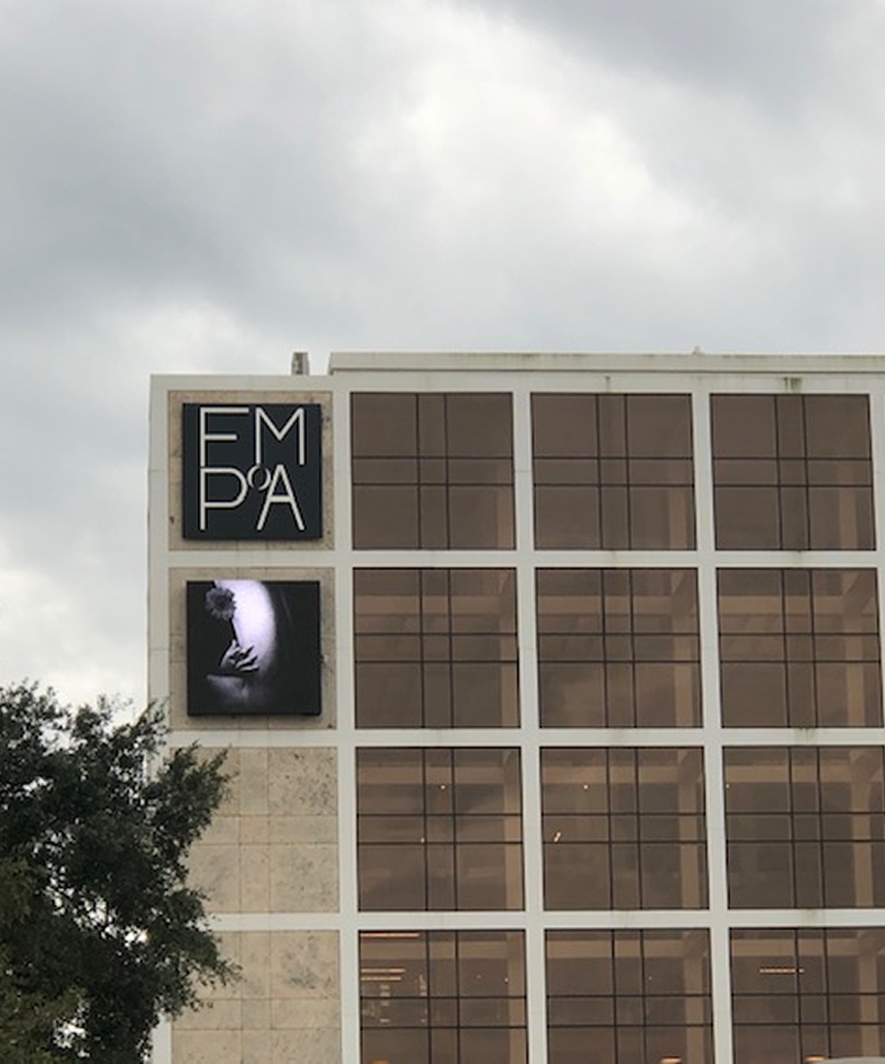 Exterior of the Florida Museum of Photographic Arts, featuring modern grid windows and museum signage