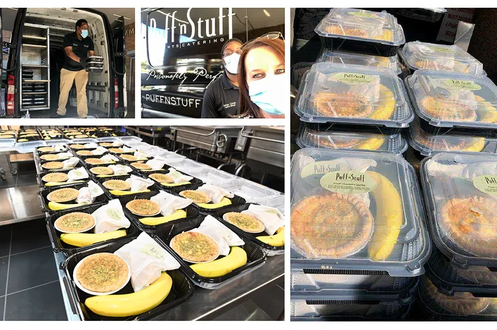 Catering team preparing and delivering individually packaged meal trays with quiche and bananas for large-scale distribution
